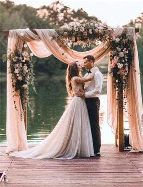wedding-draping-cost-and-ideas-pink-fabric-wedding-arch