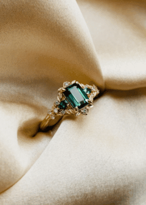 Arwen Emerald parti sapphire engagement ring