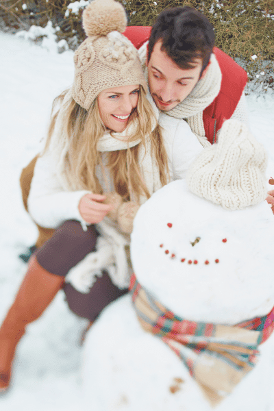 Building a Snowman winter wonderland engagement photos