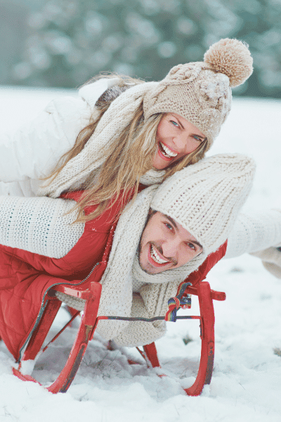 Sledding or Skiing Adventure winter engagement photoshoot