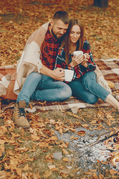 fall engagement photo picnic plaid blanket