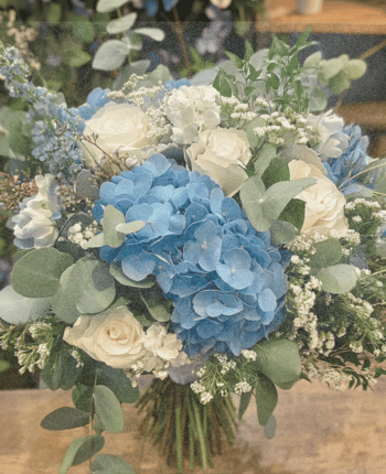 blue hydrangea white roses baby's breath wedding bouquet