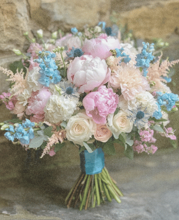 blue tweedia blush peonies waxflower wedding bouquet